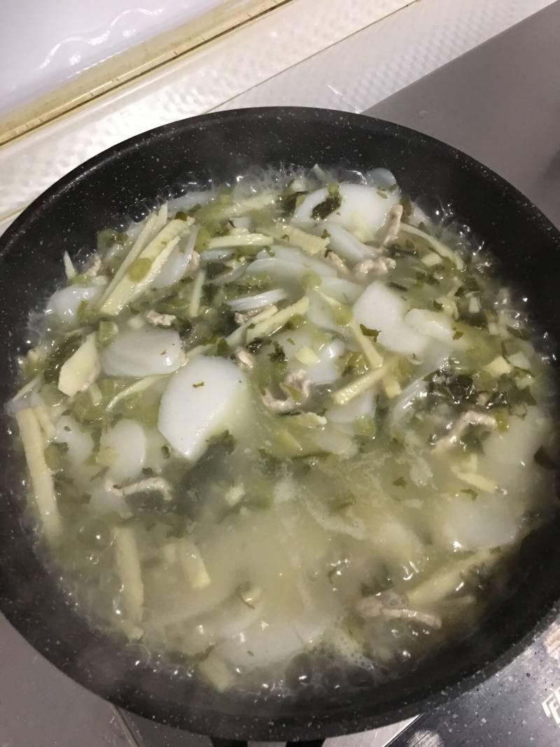 冬笋雪菜肉丝年糕汤的做法步骤：9